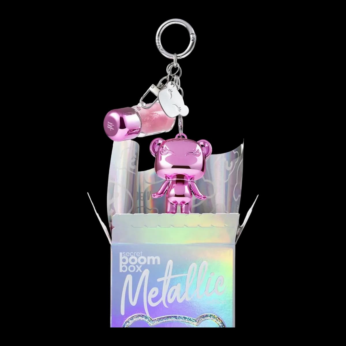 Mboomie rosa cromado com chaveiro saindo da caixa holográfica da Metallic